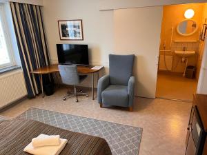 TV a/nebo společenská místnost v ubytování Budget Hotel Easystay
