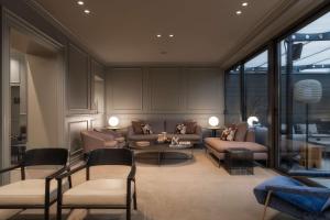 a living room with couches and a table and chairs at WorldHotel Casati 18 in Milan