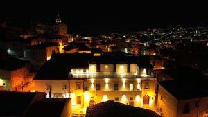 a view of a city at night with lights at Palazzo Sciretta in Rocchetta SantʼAntonio