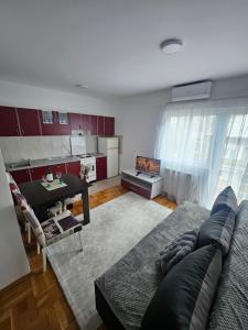 Kuchyň nebo kuchyňský kout v ubytování Apartman daba 1
