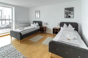 Postel nebo postele na pokoji v ubytování Penthouse-Maisonette - City Center, Highspeed Internet, Garage