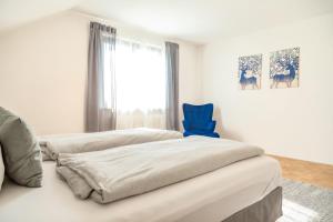 Ένα ή περισσότερα κρεβάτια σε δωμάτιο στο APARTMENT an den Weinbergen +34 φωτογραφίες