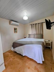 a bedroom with a large bed in a room at Pousada Liberty Noronha in Fernando de Noronha +68 photos