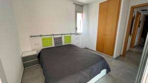 Posteľ alebo postele v izbe v ubytovaní Apartamento acogedor con piscina en Santa Margarita