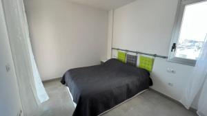 Posteľ alebo postele v izbe v ubytovaní Apartamento acogedor con piscina en Santa Margarita