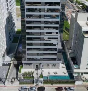 an overhead view of a tall building in a city at Apartamento 100m da Praia Brava - Itajaí in Itajaí