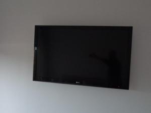 TV a/nebo společenská místnost v ubytování chambre 2 personnes Pinet