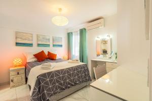 a small bedroom with a bed and a bathroom at Ocean View La Caleta in Adeje +29 photos