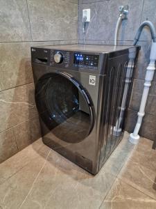 a microwave oven sitting in the corner of a bathroom at Wild Lodge in Nol