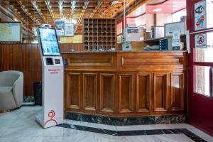 a wooden bar in a restaurant with a counter at Alda Centro Pontevedra in Pontevedra +17 photos