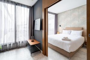 Ένα ή περισσότερα κρεβάτια σε δωμάτιο στο Studio Raffiné en Centre Ville