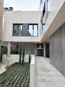 a facade of a building with a walkway at Cíes Luxury Suitel Areosa 22 in Vigo