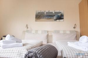 Postel nebo postele na pokoji v ubytování Ferienhaus Bungalow nahe Kurpark Döse