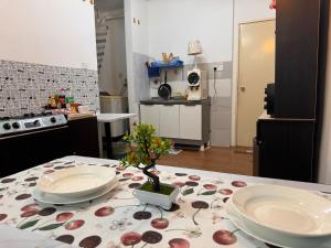 a kitchen with a table with two plates on it at 2pax 1car only Malaysian guest only bayan lepas in Bayan Lepas +17 photos
