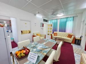 a room with a dining table and a living room at Ontrack Travel - room in Male City