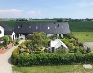 an aerial view of a house with a garden at Arnhög Farm in Borrby