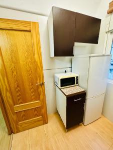 Kuchyňa alebo kuchynka v ubytovaní Apartamentos Jamé Mérida + 13 fotografií