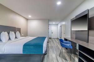 TV a/nebo společenská místnost v ubytování Motel 6-Brenham, TX