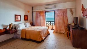Postel nebo postele na pokoji v ubytování Bruno Marambaia Charme Hotel + 37 fotografií