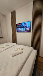 Postel nebo postele na pokoji v ubytování Zlatibor Centar Lux - Royal Apartman 544 + 17 fotografií