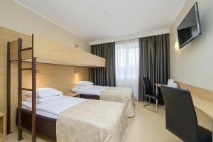 Postel nebo postele na pokoji v ubytování Hotel Rocca al Mare