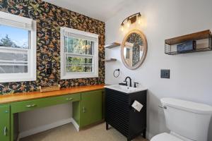 a bathroom with a sink and a toilet at Retro Getaway In Hazel Dell in Vancouver +42 photos
