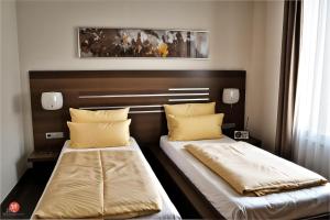Postel nebo postele na pokoji v ubytování Hotel Brühlerhöhe