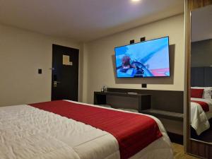 TV a/nebo společenská místnost v ubytování Hotel Granada