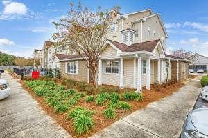 a house with a landscaping in front of it at TownePlace Suites Mobile in Mobile