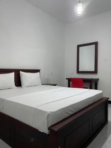 Postel nebo postele na pokoji v ubytování Golden Paradise Transit Hotel