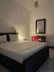 Postel nebo postele na pokoji v ubytování Golden Paradise Transit Hotel