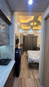 Voodi või voodid majutusasutuse Comfy Studio Apartment 5 mins from Expo Mart toas