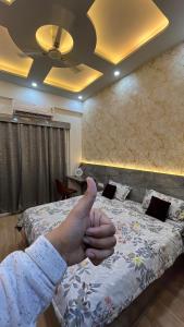 Voodi või voodid majutusasutuse Comfy Studio Apartment 5 mins from Expo Mart toas