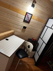 a room with a desk and a chair and a monitor at Escaper at Nereju Star Place in Carşocheşti