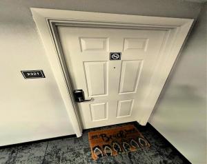 een witte deur met een bord ervoor bij Wyndham Ocean Walk Resort 2321 Vacation in Comfort and luxury - 2BR Direct Oceanfront in Daytona Beach