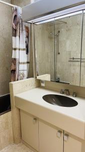 a bathroom with a sink and a mirror at Résidence Gray d'Albion Studio ROU503 in Cannes +18 photos