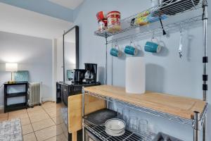 a kitchen with a counter and a shelf at 1 BR Suite w Fenced Backyard - Parking! in Tucker