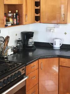 A kitchen or kitchenette at Private Room with Twin Beds AC nr Intl Airpt and Beach