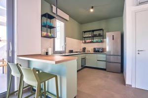 a kitchen with a counter and a refrigerator at Villa Canepa in Marsala