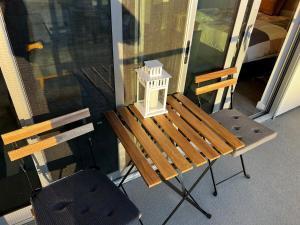 a porch with a bench and a lamp on it at Santa Monica Bright Studio with stunning view in Los Angeles