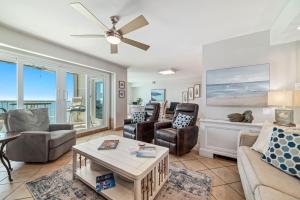 a living room with furniture and a ceiling fan at Beachfront Bliss! 1800 sq ft Spacious 3BR Sleeps 12 - Oceans 9D in Gulf Shores