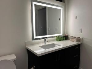 a bathroom with a sink and a mirror at Santa Monica Bright Studio with stunning view in Los Angeles +15 photos