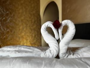 Postel nebo postele na pokoji v ubytování Hotel Savoia