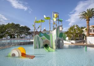 a water park with a slide in a swimming pool at Hotel Jardín Tecina in Playa de Santiago