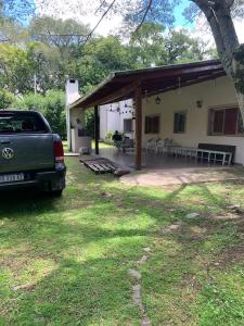 a car parked in front of a house at Naturaleza Pura Casa La Caldera in Salta