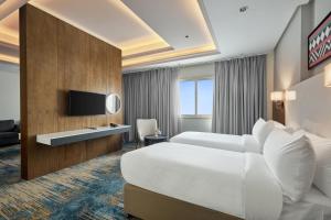 Ένα ή περισσότερα κρεβάτια σε δωμάτιο στο Nur Al Naseem by Makarem