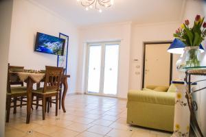a living room with a table and a couch at Amalfi Coast - House Along the Amalfi Coast -FREE PARKING in Vietri sul Mare