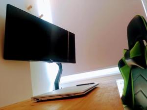 a flat screen tv sitting on top of a table at Loft PLAYA -60m- & TRABAJO -online- in Almería