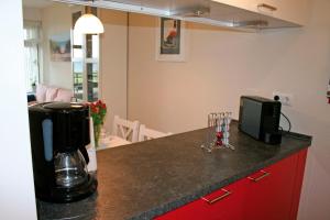 a kitchen with a counter with a coffee maker on it at Meeresrauschen in Staberdorf