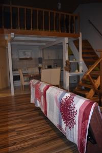 a living room with a table with a blanket on it at Apartman Marko in Tribunj